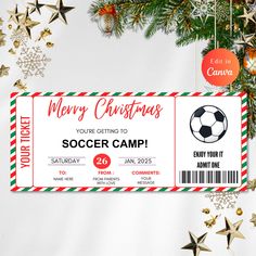 a christmas soccer camp ticket sitting on top of a table next to ornaments and decorations