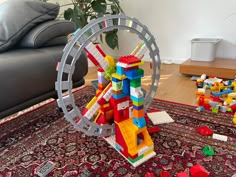 a toy ferris wheel on top of a rug