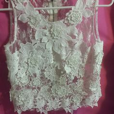 Lace Bone White White Sleeveless Crop Top For Wedding, White Sleeveless Feminine Crop Top, Feminine White Sleeveless Crop Top, Elegant Spring Lace Crop Top, White Feminine Party Top, White Sleeveless Lace Crop Top, Elegant White Crop Top For Summer, Elegant White Summer Crop Top, White Lace Top For Spring Party