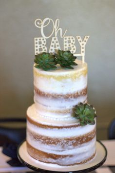 a baby shower cake with succulents on top