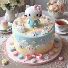 a hello kitty birthday cake on a table