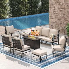 an outdoor patio furniture set near a swimming pool