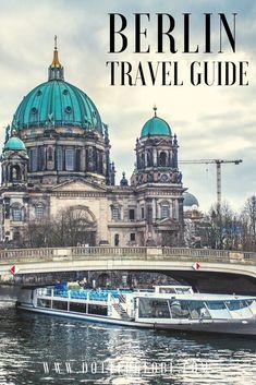 the berlin travel guide is on display in front of an old bridge and dome building