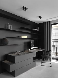 a black and white photo of a modern home office