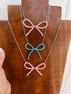 Western natural turquoise & pink shell bow necklaces. This are one of a kind necklaces on 16"-18" adjustable silver plated chain. Please specify what stone you would like when purchasing. Pink Western Jewelry, Bead Projects Ideas, 2025 List, Necklace Making Ideas, Grad 2025, 15th Birthday Gift Ideas, Cute Western Outfits, Boutique Aesthetic, Silversmithing Jewelry