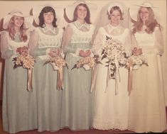 an old photo of bridesmaids in dresses and hats