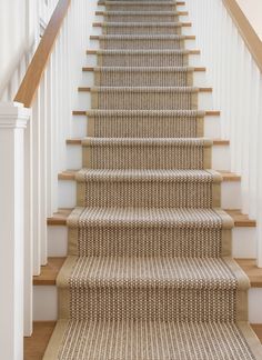 a carpeted staircase leading up to the second floor