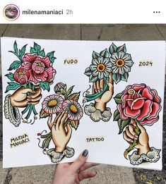 a person holding up a piece of paper with tattoos on it and flowers in their hands