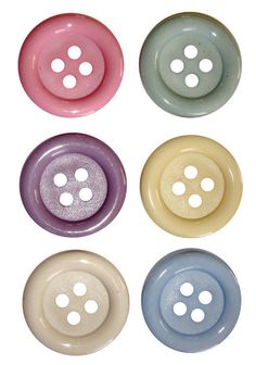 four different colored buttons with holes in them