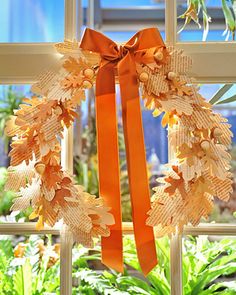 an orange ribbon is hanging from a window