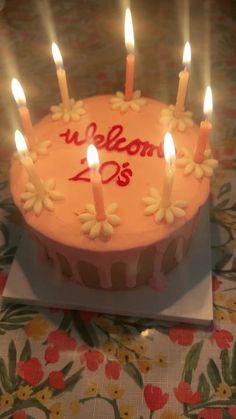 a birthday cake with lit candles on it