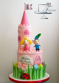 there is a cake that looks like a castle with two children on top and a lady bug