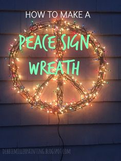 a peace sign with lights around it that says how to make a peace sign wreath