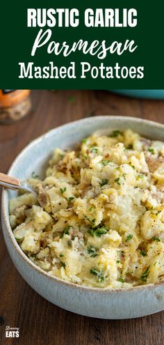 a white bowl filled with mashed potatoes on top of a wooden table