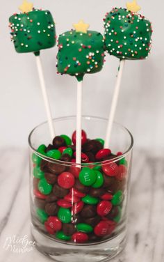 some green and red candies in a glass bowl