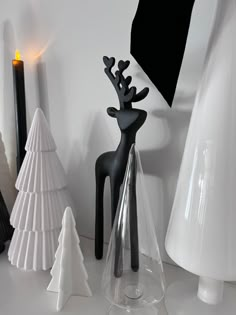 some white and black christmas decorations on a table