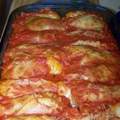 a casserole dish with meat and tomato sauce on it, ready to be eaten