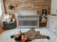 a baby's room with a crib and stuffed animals