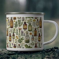 a white coffee mug with various herbs and bottles on it sitting on a tree stump