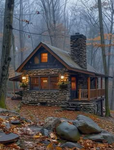 a small cabin in the woods with rocks and leaves on the ground next to it