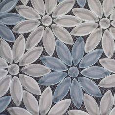 a close up view of an artistic tile design