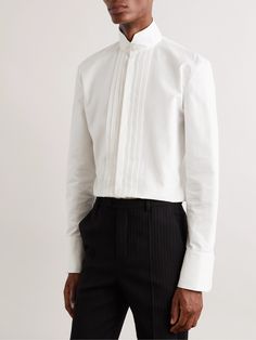 SAINT LAURENT's subtle alterations help you personalise black tie dress codes. This bib-front tuxedo shirt has been tailored in Italy from crisp cotton-poplin and features a tall grandad collar that secures with mother-of-pearl buttons. Feel free to skip the bow tie. Tuxedo Shirt For Men, Mens Tux, Saint Laurent Collection, Grandad Collar Shirt, Tux Shirt, Mens White Dress Shirt, Black Tie Dress Code, Tuxedo Shirt Men, Black And White Tuxedo