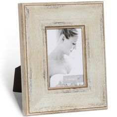 a white wooden frame with a woman's profile in it