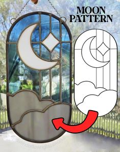 an image of a stained glass window with the moon and crescent on it, hanging from a chain