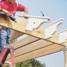 a man working on a wooden structure with tools