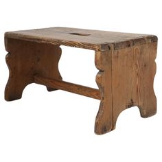 an old wooden bench is shown against a white background