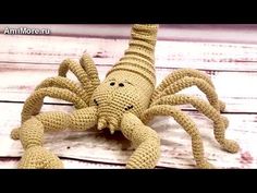 a crocheted stuffed animal sitting on top of a wooden floor