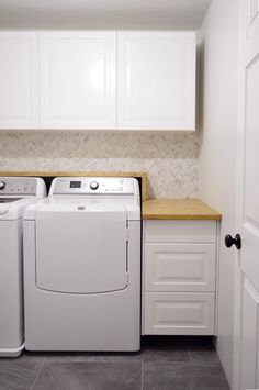 the parts of a washer and dryer in a laundry room