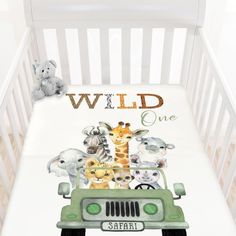 a baby crib with an animal themed bedding