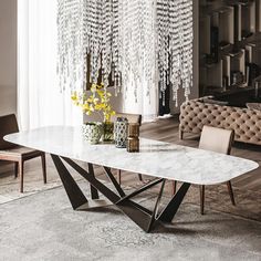 a white marble dining table in a living room