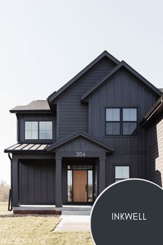 a black house with the words inkwell on it's front door and side windows