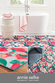 a bath tub sitting on top of a wooden floor next to a flowered rug