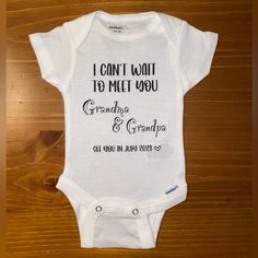 a white onesuit with the words i can't wait to meet you grandpa and grandma on it