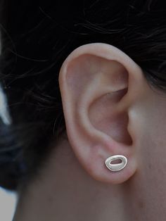 Enhance your everyday look with the whimsical shapes of these silver stud earrings. Volcanic islands from across the globe inspired the Hibu studs. These organic forms appear throughout the Tiny Islands collection, as both rings and earrings. Handmade sterling silver stud earrings with sterling backs 7mm x 9mm Organic Earrings, Everyday Earrings Studs, Unique Handcrafted Jewelry, Organic Forms, Tiny Studs, Sterling Silver Stud Earrings, Handmade Jewelry Designs, Organic Form, Silver Stud Earrings