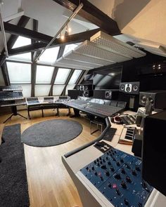 a recording studio with many sound equipment in it