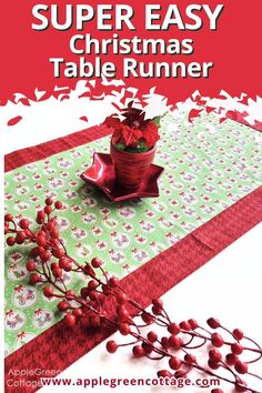 a christmas table runner with red berries on it and the text super easy christmas table runner