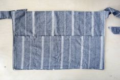 an apron made out of old jeans on a table