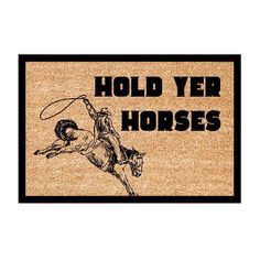 a door mat with the words holdyer horses and a cowboy riding a bucking horse