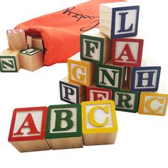 wooden blocks with letters spelling the word abc on them