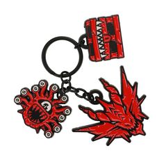 a red and black keychain with an image of a dragon on it