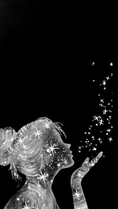 a black and white photo of a woman blowing stars out of her hand in the dark