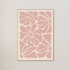 a pink and white painting hanging on the wall next to a vase with flowers in it