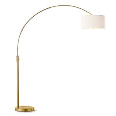 a floor lamp with a white shade on the base and a gold metal finish frame