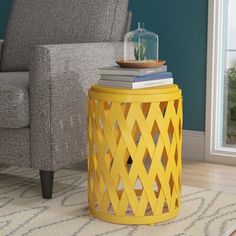 a living room with a gray chair and yellow side table in front of a window