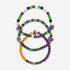 three bracelets with the word joker and two different beads on each beaded strand