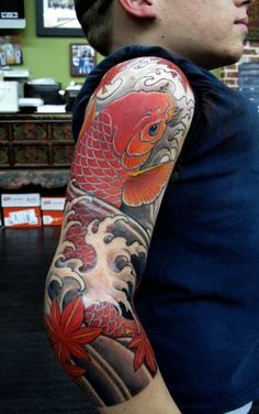 a man with a tattoo on his arm